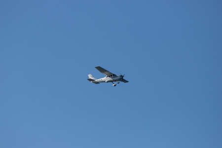 Sydney, Australia - July 4, 2020: Cessna 182T flying on blue sky. Registration: VH-MJB.のeditorial素材