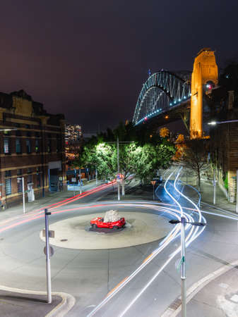 Sydney, Australia - July 17, 2020: Car trails at Hickson Rd with Sydney Harbour Bridge on the background.のeditorial素材