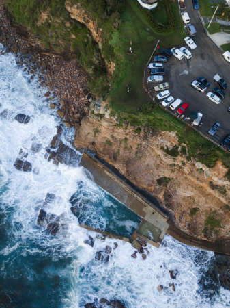 Top down view of hill top and Avalon Beach rock pool.の写真素材