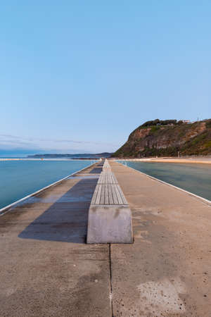 Empty bench around Merewether rock pool, Newcastle, Australia.の写真素材
