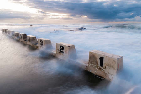 Sea water flowing into Merewether Ocean Bath, Newcastle, Australia.の写真素材