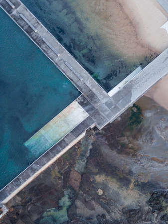 Top down view of the Merewether ocean pool edge with rock on the outside, Newcastle, Australia.の写真素材