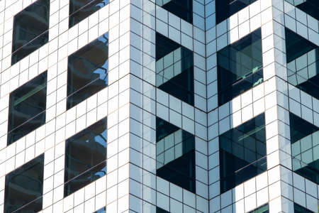 Sydney, Australia - October 3, 2020: White tile and black glass building facade.