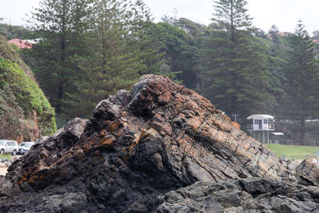 Big brown rock on the beach coastline.の写真素材