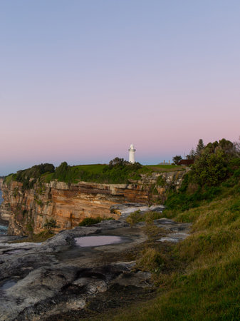 Sunrise view of Macquarie Lighthouse by the ocean, Sydney, Australia.の写真素材