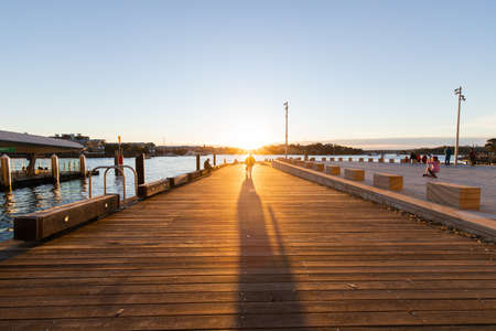 Sydney, Australia - June 13, 2021: People enjoying sunset at Barangaroo wharf.のeditorial素材
