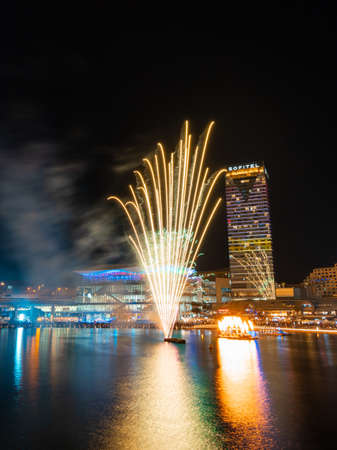 Sydney, Australia - June 11, 2021: Yellow fireworks at Darling Harbour for Sydney Solstice.のeditorial素材