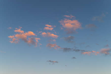 Beautiful colorful clouds on blue sunset sky.の写真素材