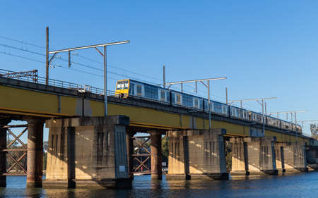 Sydney, Australia - August 14, 2021: Train passing through John Whitton Bridge across Parramatta...