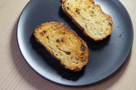 Slice of toasted bread on a plate.の写真素材