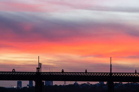 Silhouette of bridge at sunset over Parramatta River, Sydney, Australia.