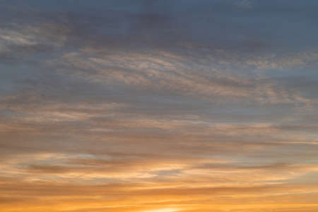 Dramatic cloud formation on sunset sky.の写真素材
