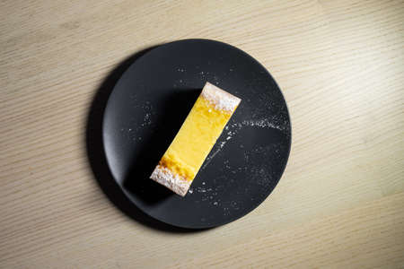 Slice of cheesecake on a small plate.の写真素材