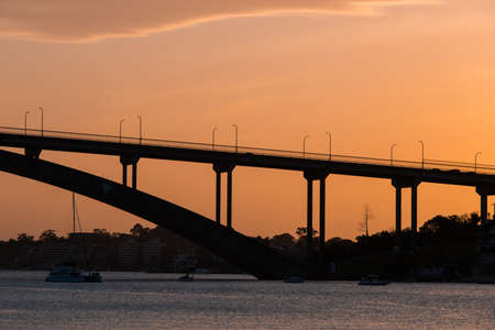 Sydney, Australia - October 8, 2021: Silhouette of Gladesville Bridge at sunset time.のeditorial素材