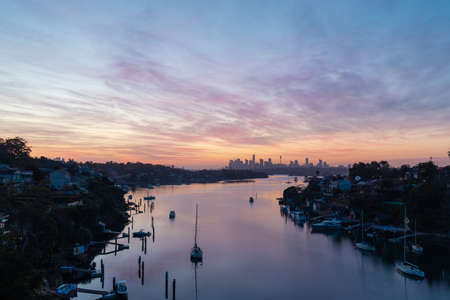 Sydney, Australia - October 9, 2021: Dawn view of Sydney skyline with colorful clouds.のeditorial素材