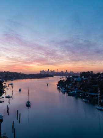 Sydney, Australia - October 9, 2021: Dawn view of Sydney skyline with colorful clouds.のeditorial素材