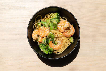 A bowl of prawn and broccoli spaghetti.の写真素材