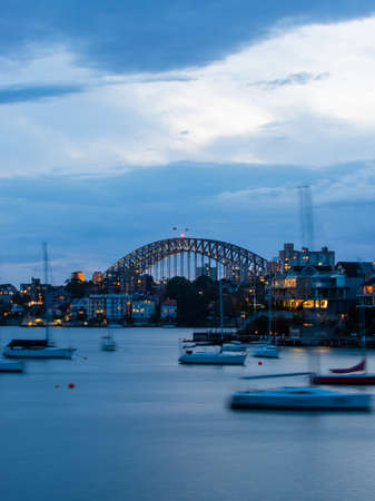 Sydney, Australia - November 6, 2021: Sydney Harbour Bridge view with few boats in the front.のeditorial素材