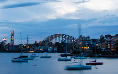 Sydney, Australia - November 6, 2021: Sydney Harbour Bridge view with few boats in the front.のeditorial素材