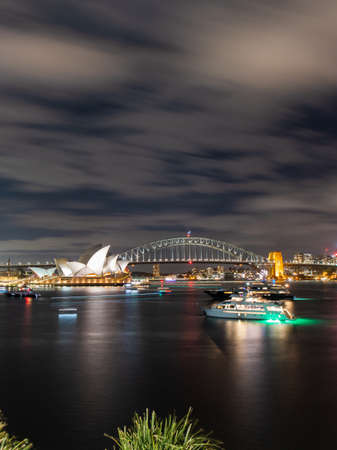 Sydney, Australia - December 11, 2021: Night view of Sydney Opera House and Harbour Bridge.