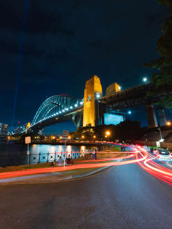 Sydney, Australia - January 1, 2022: Car trails around the Sydney Harbour at night.のeditorial素材