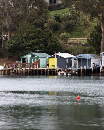Narooma, Australia - January 5, 2022: Boathouse by the water around Narooma marina area.のeditorial素材