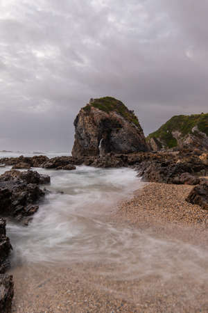 Cloudy view around the rocky coastline.の写真素材
