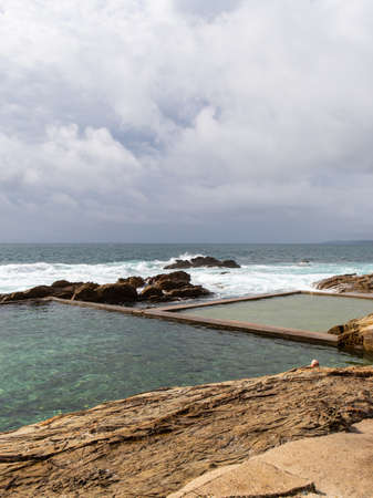 Bermagui Blue Pool under the cloudy sky, NSW, Australia.の写真素材