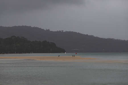 Sand island and layer of the mountain by the lake.の写真素材