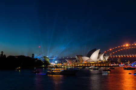 Sydney, Australia - January 26, 2022: Sydney Harbour light up at night time.