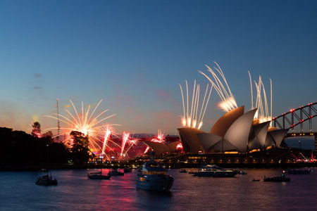 Sydney, Australia - January 26, 2022: Small fireworks at Sydney Harbour at dusk.のeditorial素材