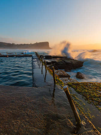 Wave crashed on the side of rock pool at Avalon Beach, Sydney, Australia.の写真素材