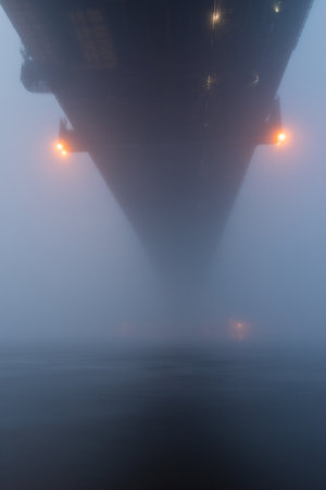 View from below Sydney Harbour Bridge in the foggy morning.の写真素材