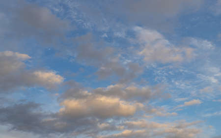 Blue sky with patchy clouds.の写真素材