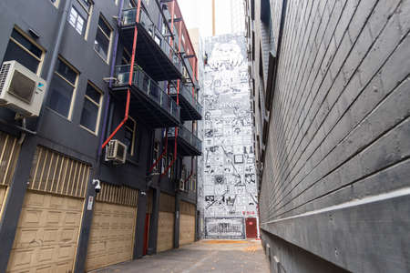 Melbourne, Australia - April 2, 2022: Wall of graffiti between buildings.のeditorial素材
