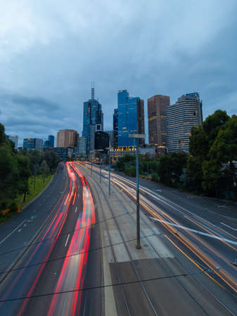Melbourne, Australia - April 2, 2022: Car traffic at Batman Ave and CBD skyline.のeditorial素材