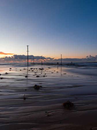 Seaweed and sand pattern in the morning at Mona Vale Beach, Sydney, Australia.の写真素材