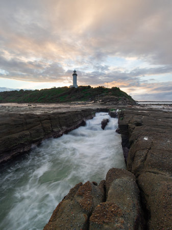 Water flow on the rock channel at Norah Head Lighthouse.の写真素材