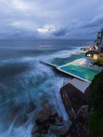 Sydney, Australia - February 27, 2022: Cloudy dawn view at Bondi Beach coastline.のeditorial素材