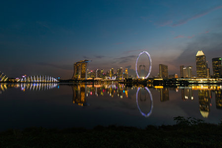 Singapore - May 20, 2022: Singapore skyline view at night with reflections.のeditorial素材