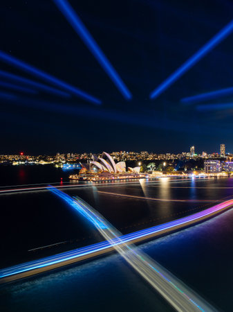 Sydney, Australia - May 31, 2022: Sydney Opera House lights up with ferry light trails during Vivid Sydney.のeditorial素材