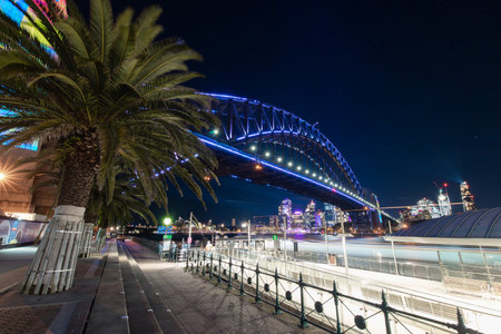 Sydney, Australia - June 6, 2022: Sydney Harbour Bridge view with blue light.のeditorial素材