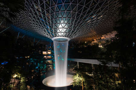 Singapore - May 19, 2022: Night time view of Jewel Changi Airport waterfall vortex.のeditorial素材