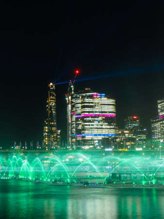 Sydney, Australia - June 8, 2022: Green colored fountain show at Darling Harbour for Vivid Sydney.のeditorial素材