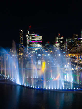 Sydney, Australia - June 8, 2022: Blue colored fountain show at Darling Harbour for Vivid Sydney.のeditorial素材
