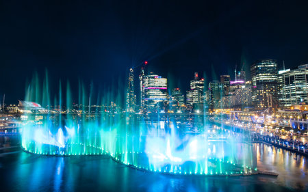 Sydney, Australia - June 8, 2022: Green colored fountain show at Darling Harbour for Vivid Sydney.のeditorial素材