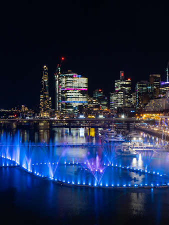 Sydney, Australia - June 8, 2022: Blue colored fountain show at Darling Harbour for Vivid Sydney.のeditorial素材