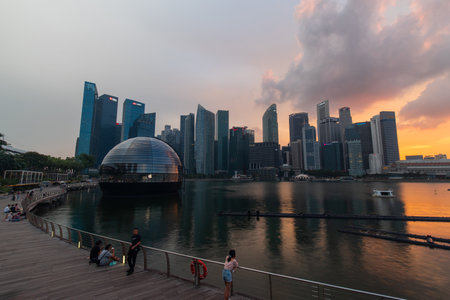 Singapore - May 21, 2022: Sunset view of Singapore skyline from Marina Bay Sands.のeditorial素材