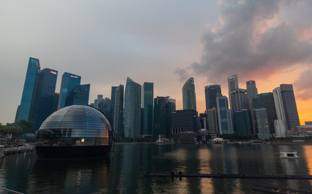 Singapore - May 21, 2022: Sunset view of Singapore skyline from Marina Bay Sands.のeditorial素材