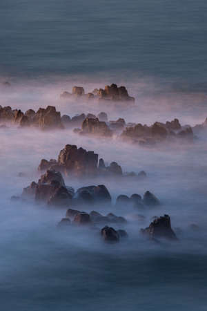 Small rock formation on the ocean.の写真素材
